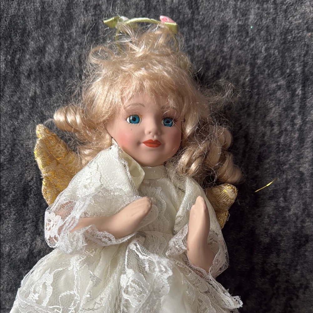 Porcelain Angel Doll with Golden Wings
